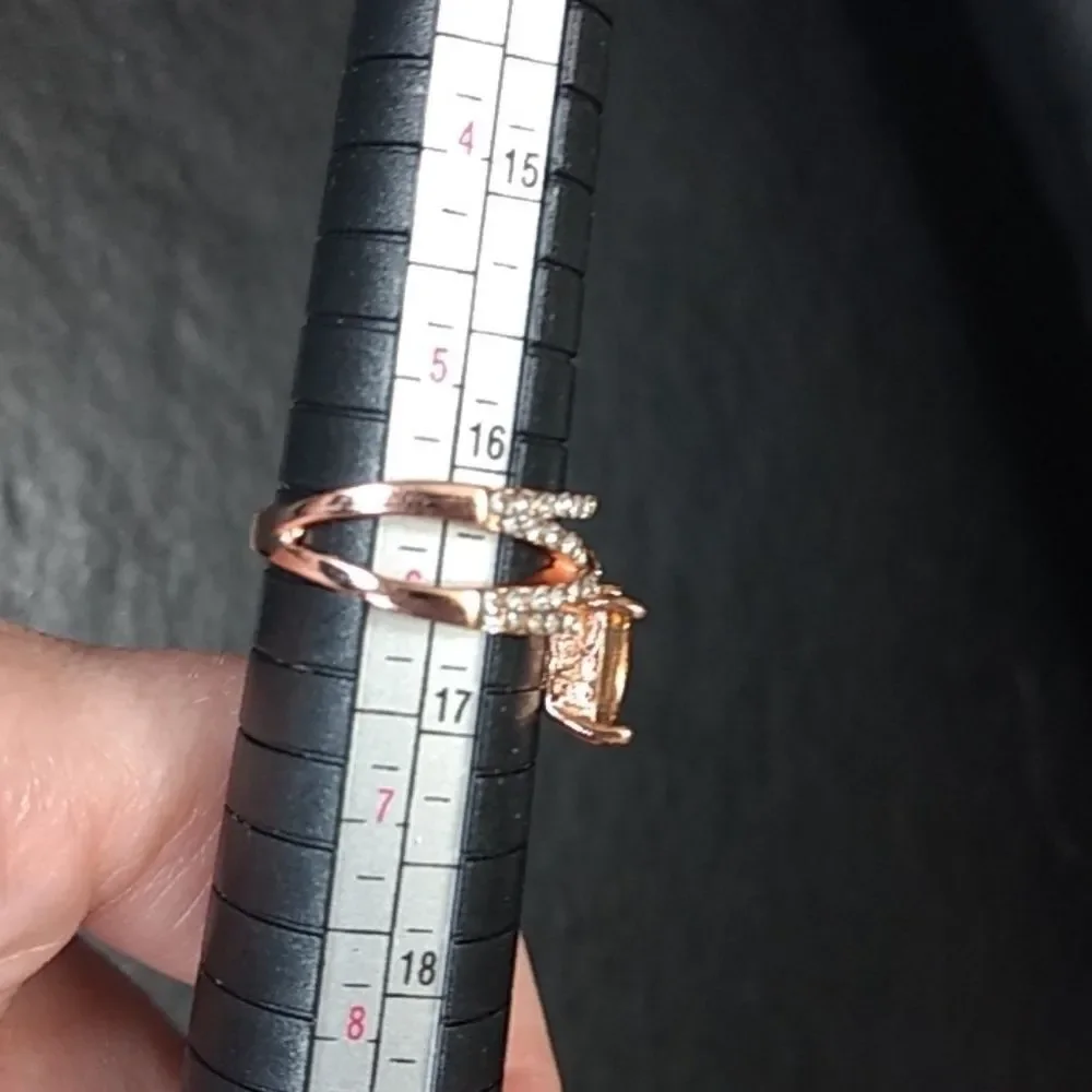 Rose gold colored ring with champagne stone Size 6